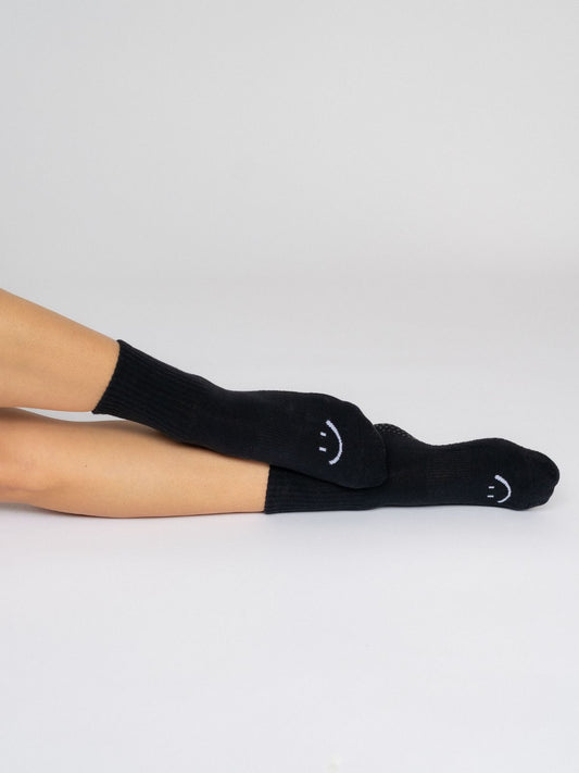 Women's non-slip grip socks for Pilates and yoga – black with white smile