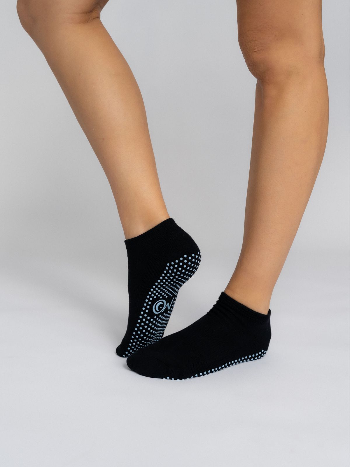 Non-slip women's Pilates and yoga short grip socks black color with blue grip
