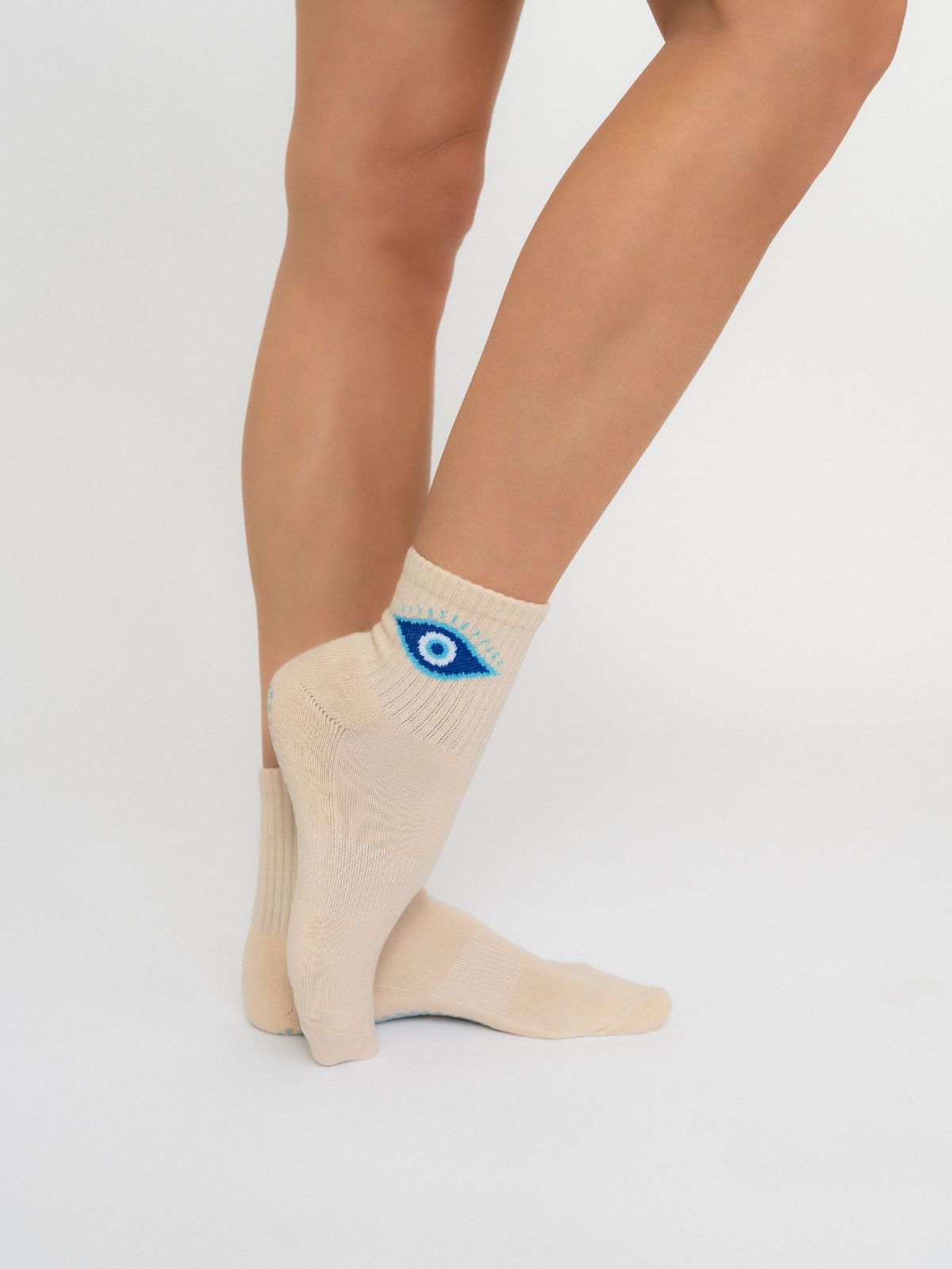 Women's  Pilates  and yoga non-slip grip socks – creamy with evil eye logo