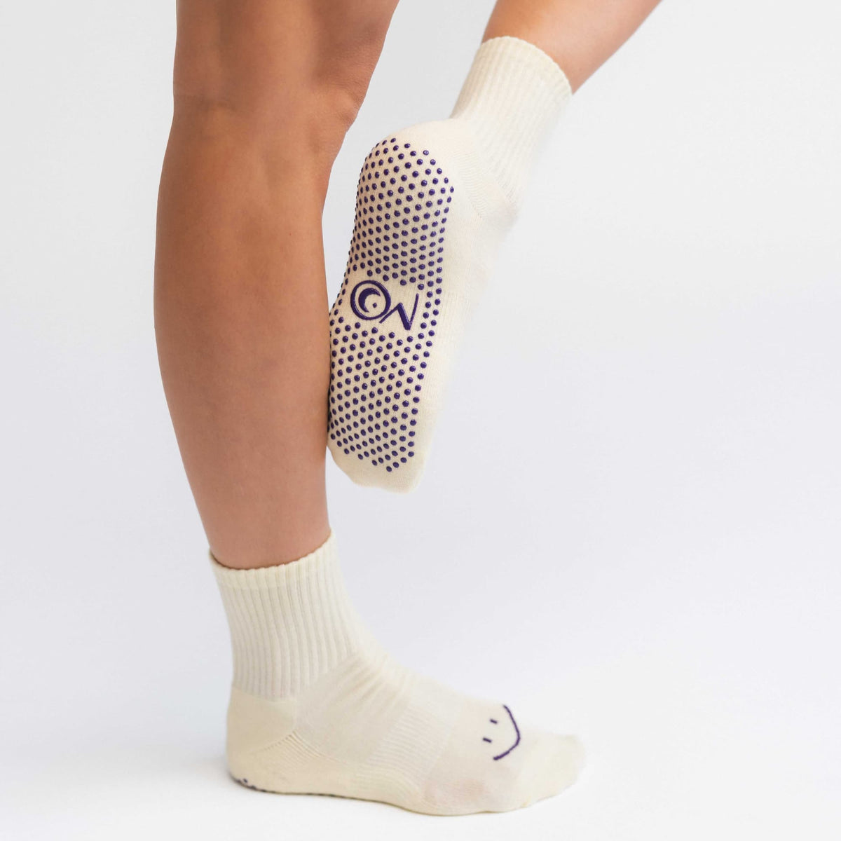 Purple Smile Pilates grip socks in purple with smile design
